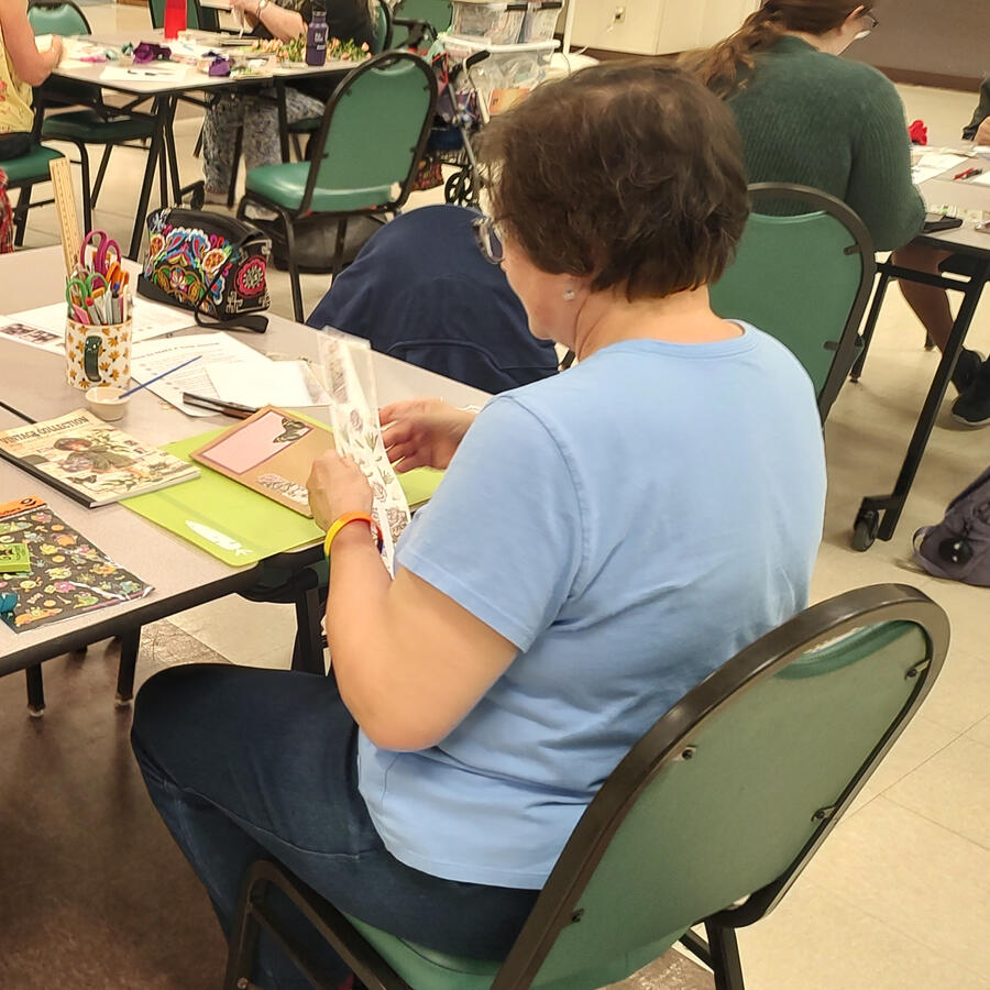 A person making a junk journal