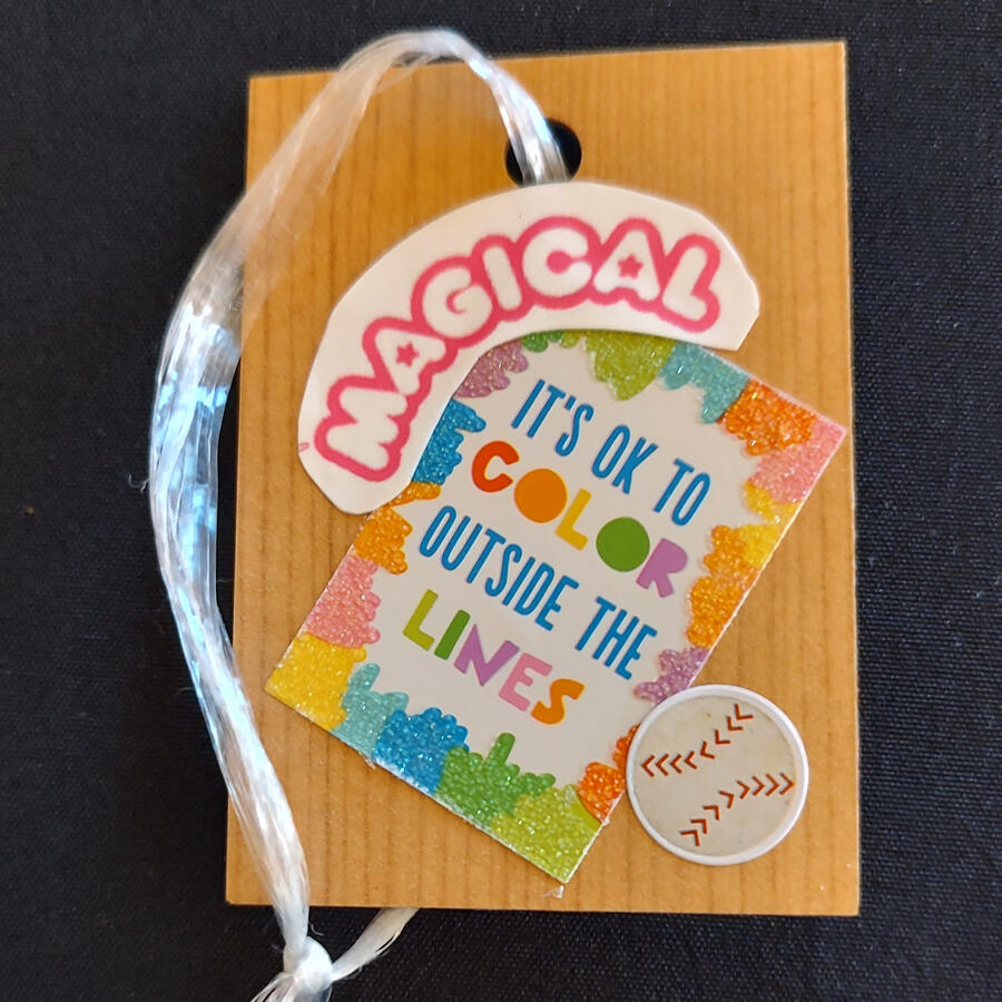 Floor tiles, and product packaging reused as an ornament covered in stickers.