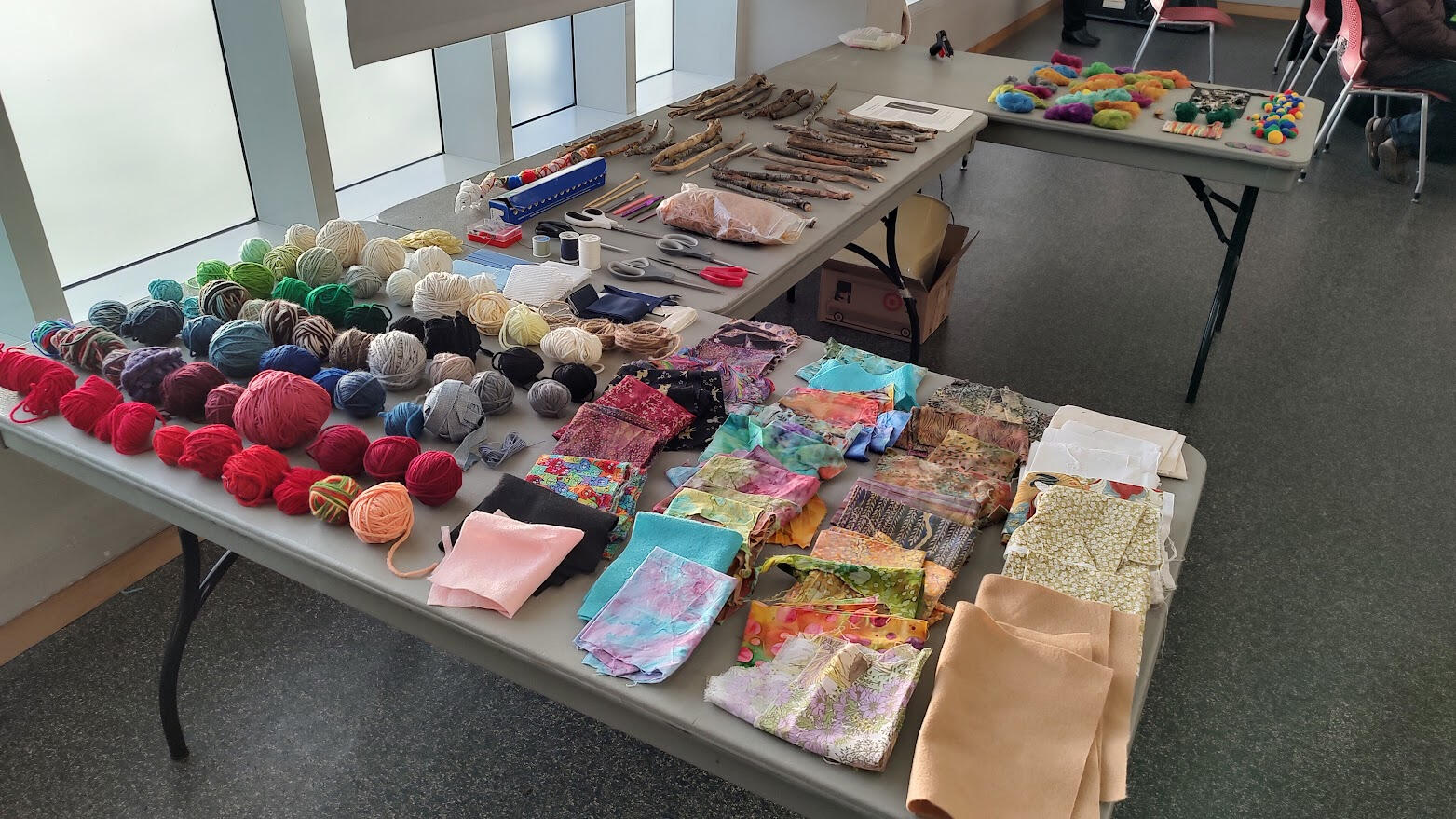 Craft label full of natural items and wonderful trash that escaped getting thrown away. Vas standing in front of a table full of art supplies